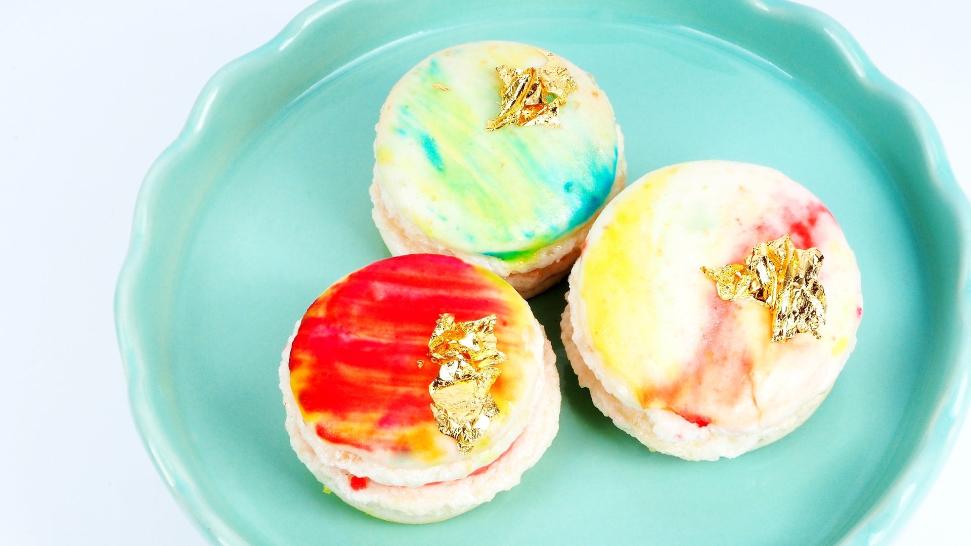 Watercolour macarons with gold flakes