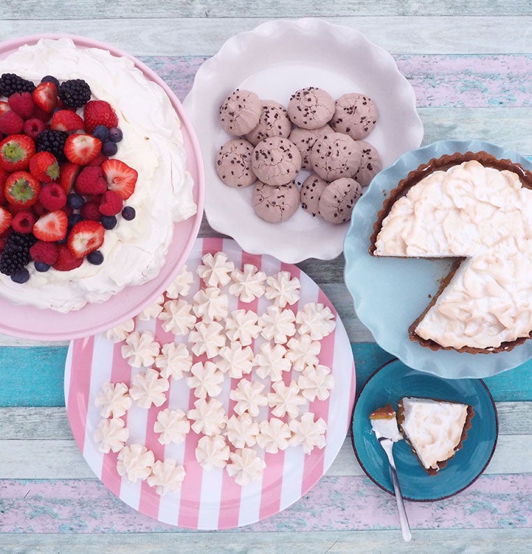 Pavlova cake with whipped cream and fresh fruit