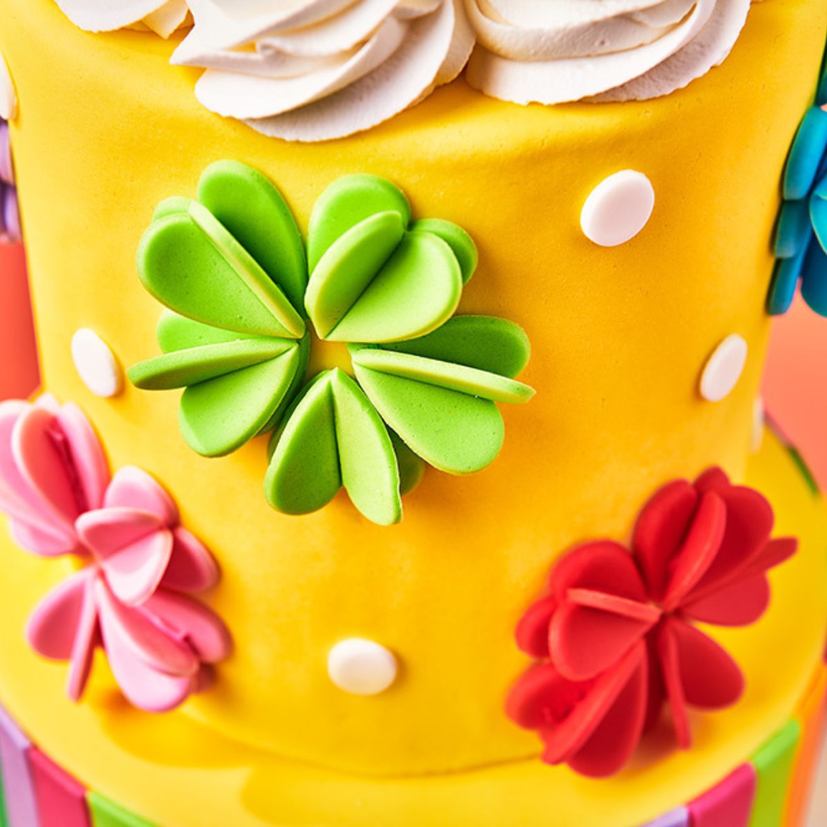 Tiered cake with 3D flowers and stripes